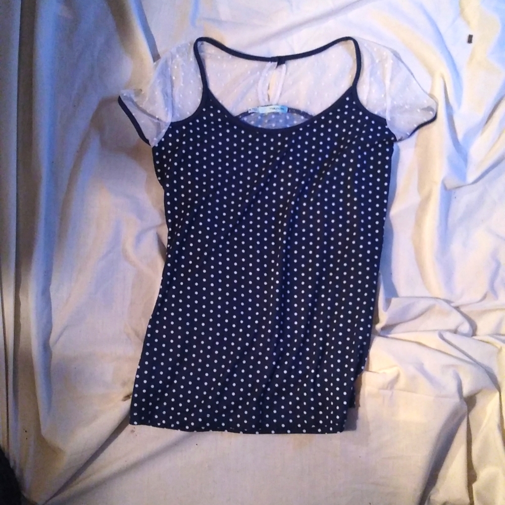 Small short sleeve dress shirt. I got it from Maurice's. Only wore once.